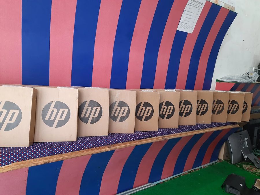 Row of new HP laptop boxes in stock at Cyber Corporation